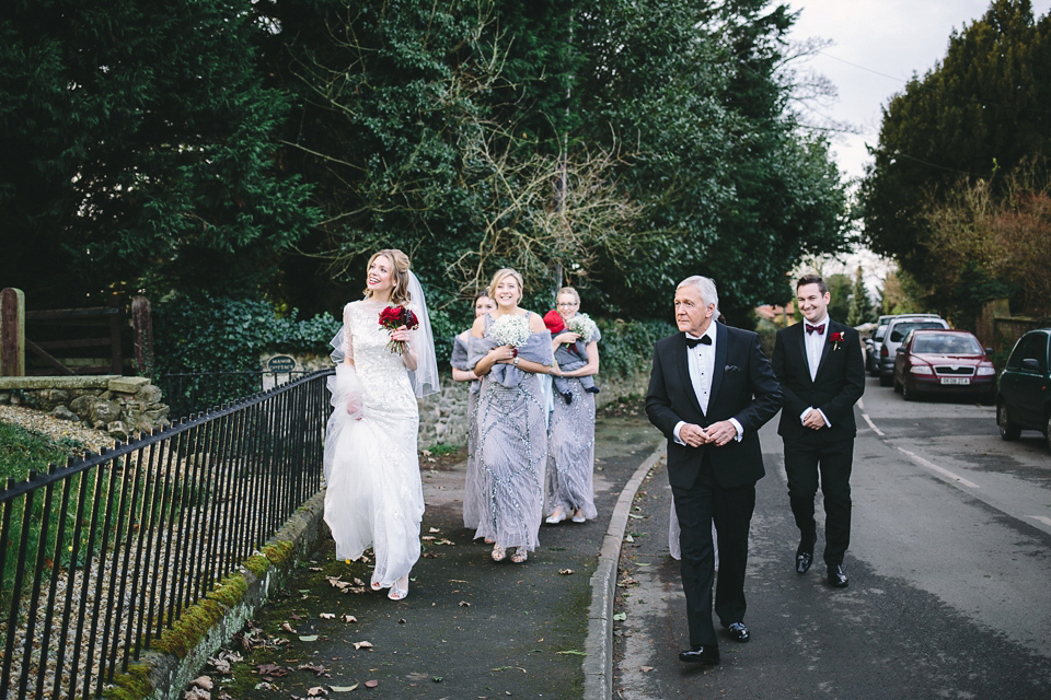 Laura wears 'Mimosa' by Jenny Packham for her winter wedding on the family farm in York. Photography by Kate Gray.