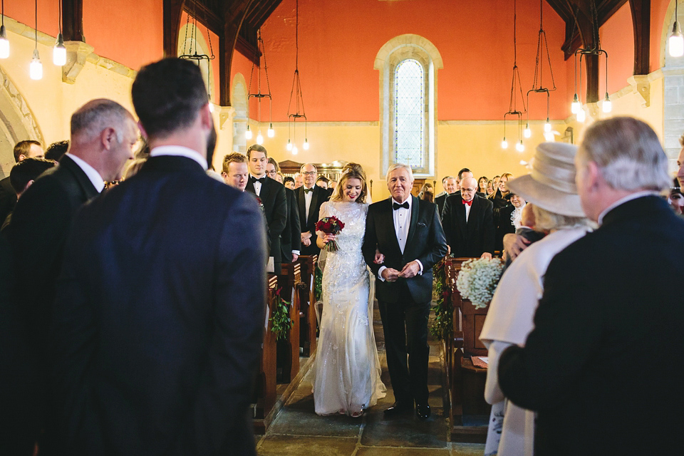 Laura wears 'Mimosa' by Jenny Packham for her winter wedding on the family farm in York. Photography by Kate Gray.