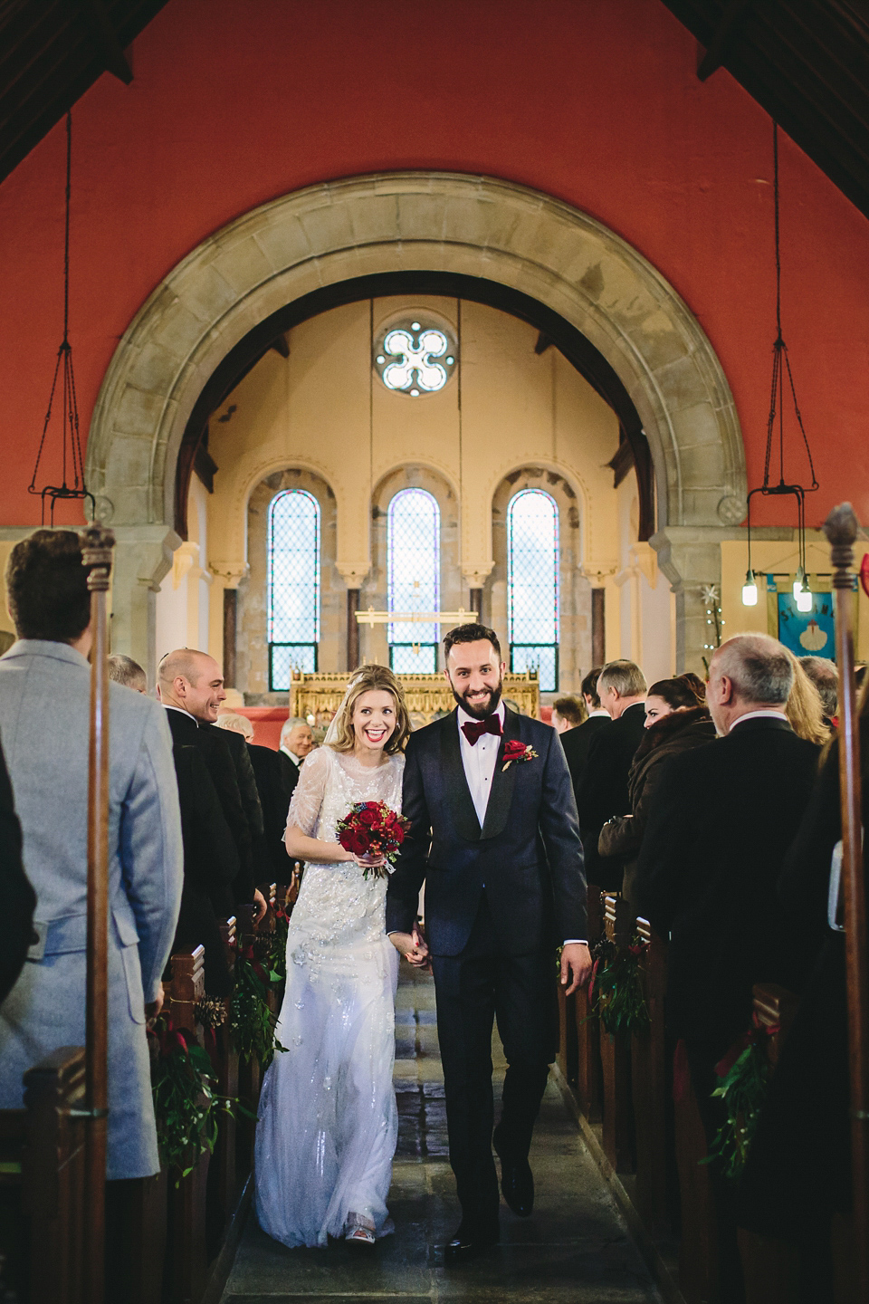 Laura wears 'Mimosa' by Jenny Packham for her winter wedding on the family farm in York. Photography by Kate Gray.