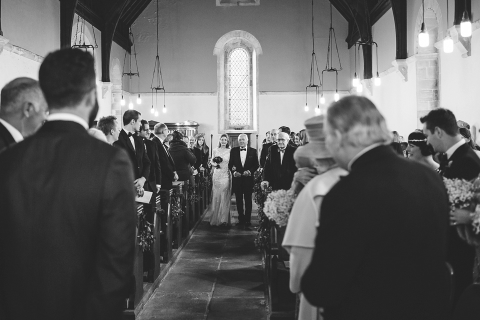 Laura wears 'Mimosa' by Jenny Packham for her winter wedding on the family farm in York. Photography by Kate Gray.