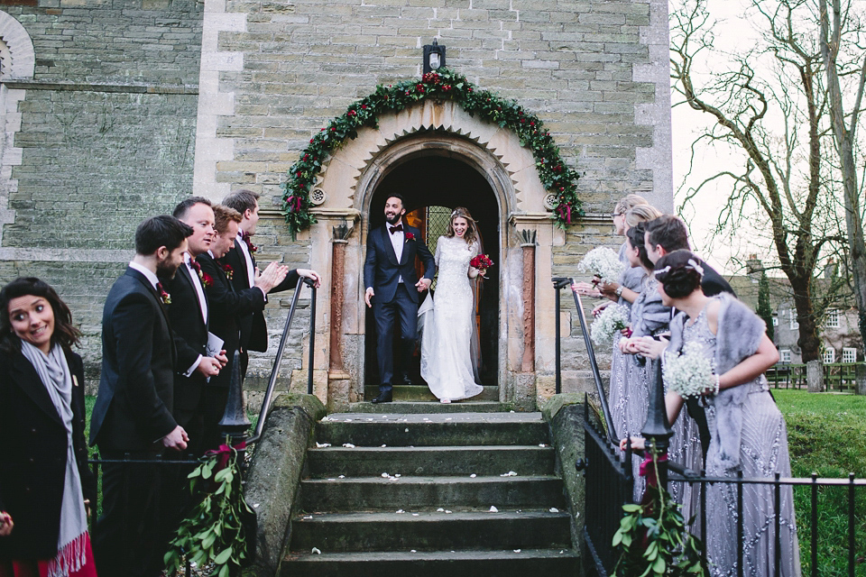 Laura wears 'Mimosa' by Jenny Packham for her winter wedding on the family farm in York. Photography by Kate Gray.