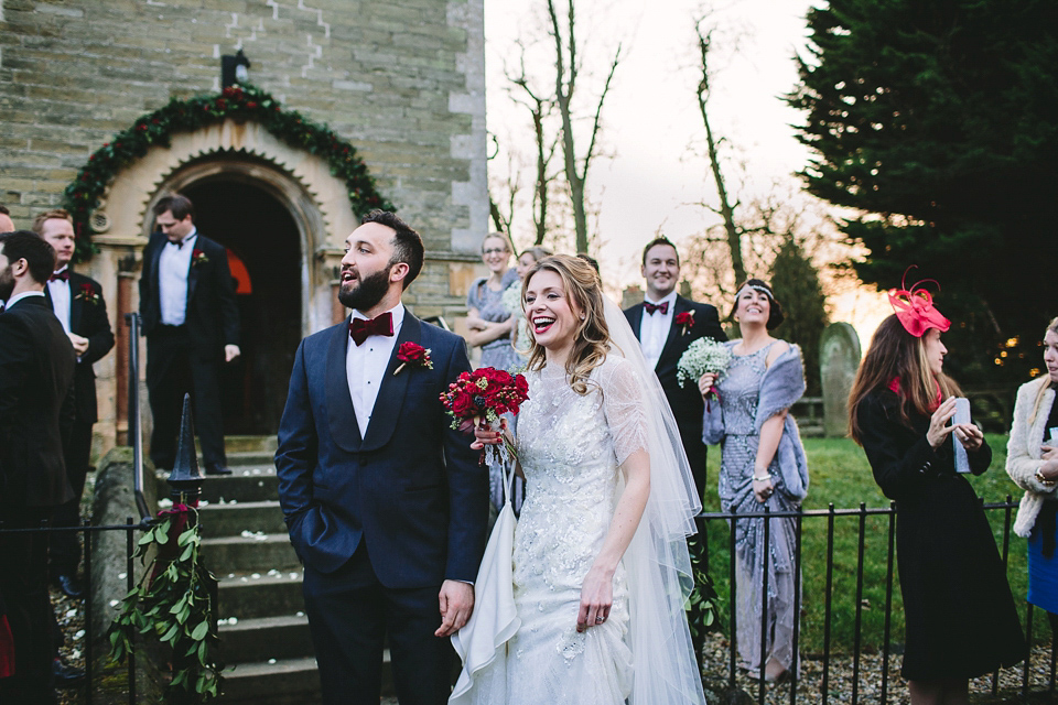 Laura wears 'Mimosa' by Jenny Packham for her winter wedding on the family farm in York. Photography by Kate Gray.