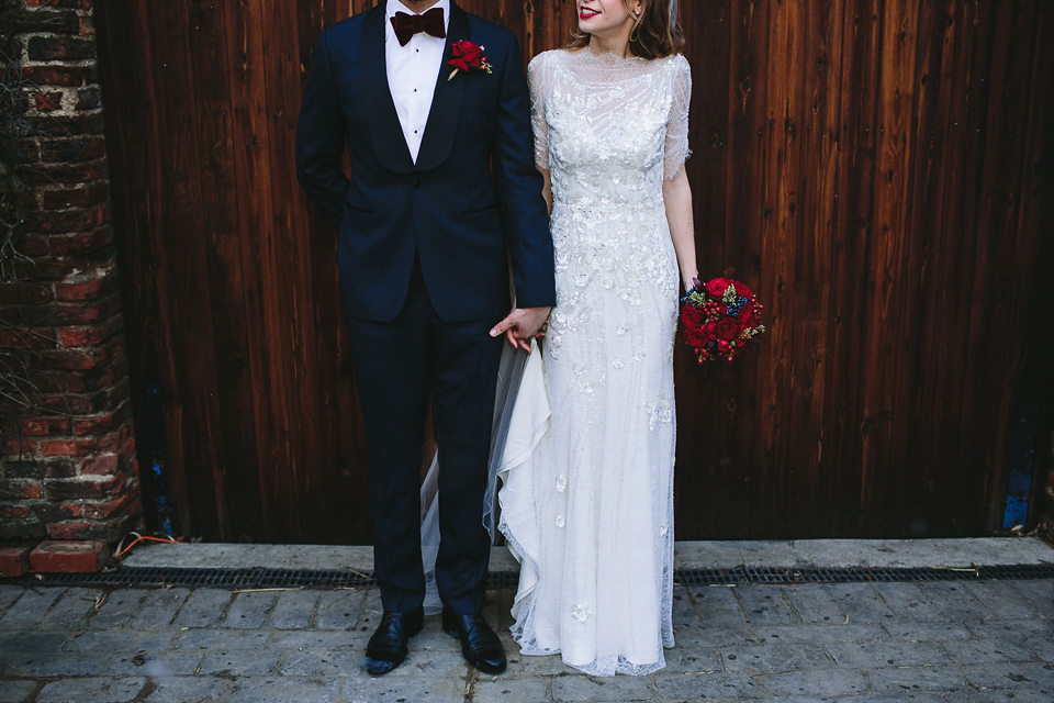 Laura wears 'Mimosa' by Jenny Packham for her winter wedding on the family farm in York. Photography by Kate Gray.