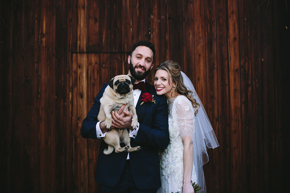 Laura wears 'Mimosa' by Jenny Packham for her winter wedding on the family farm in York. Photography by Kate Gray.