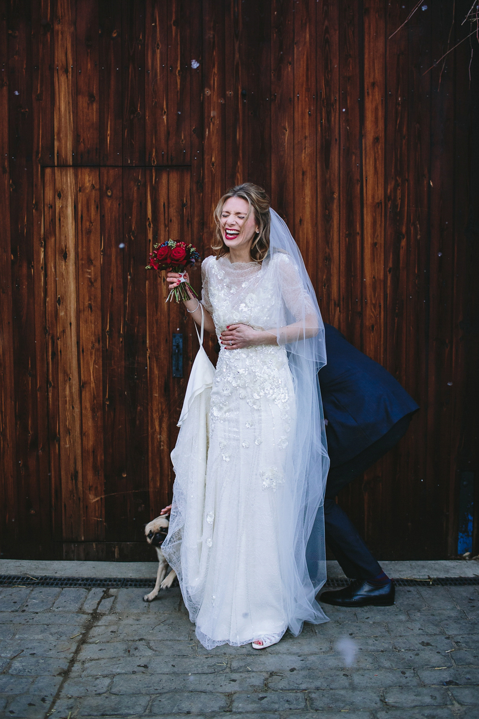 Laura wears 'Mimosa' by Jenny Packham for her winter wedding on the family farm in York. Photography by Kate Gray.