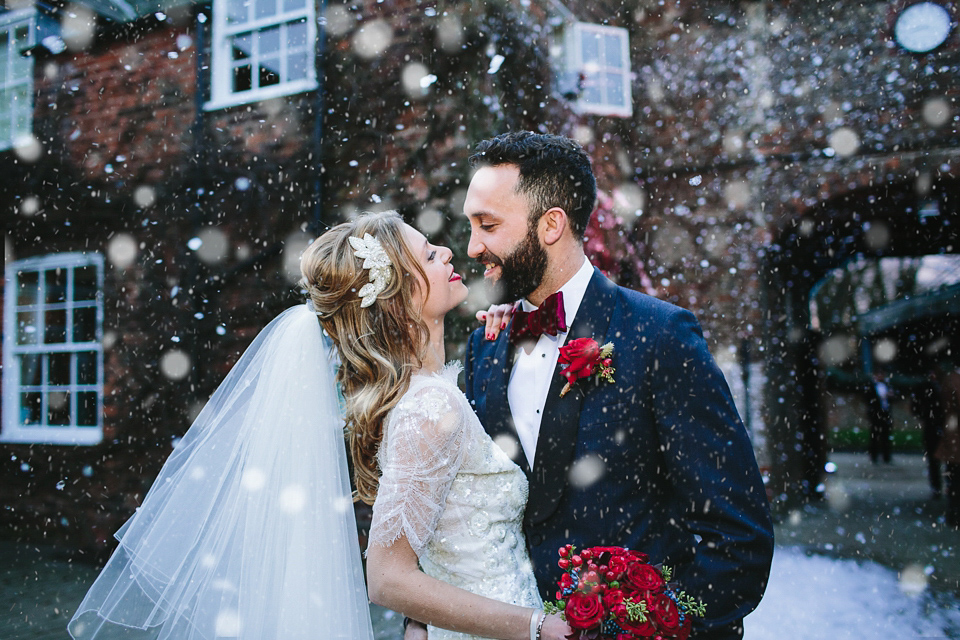 Laura wears 'Mimosa' by Jenny Packham for her winter wedding on the family farm in York. Photography by Kate Gray.