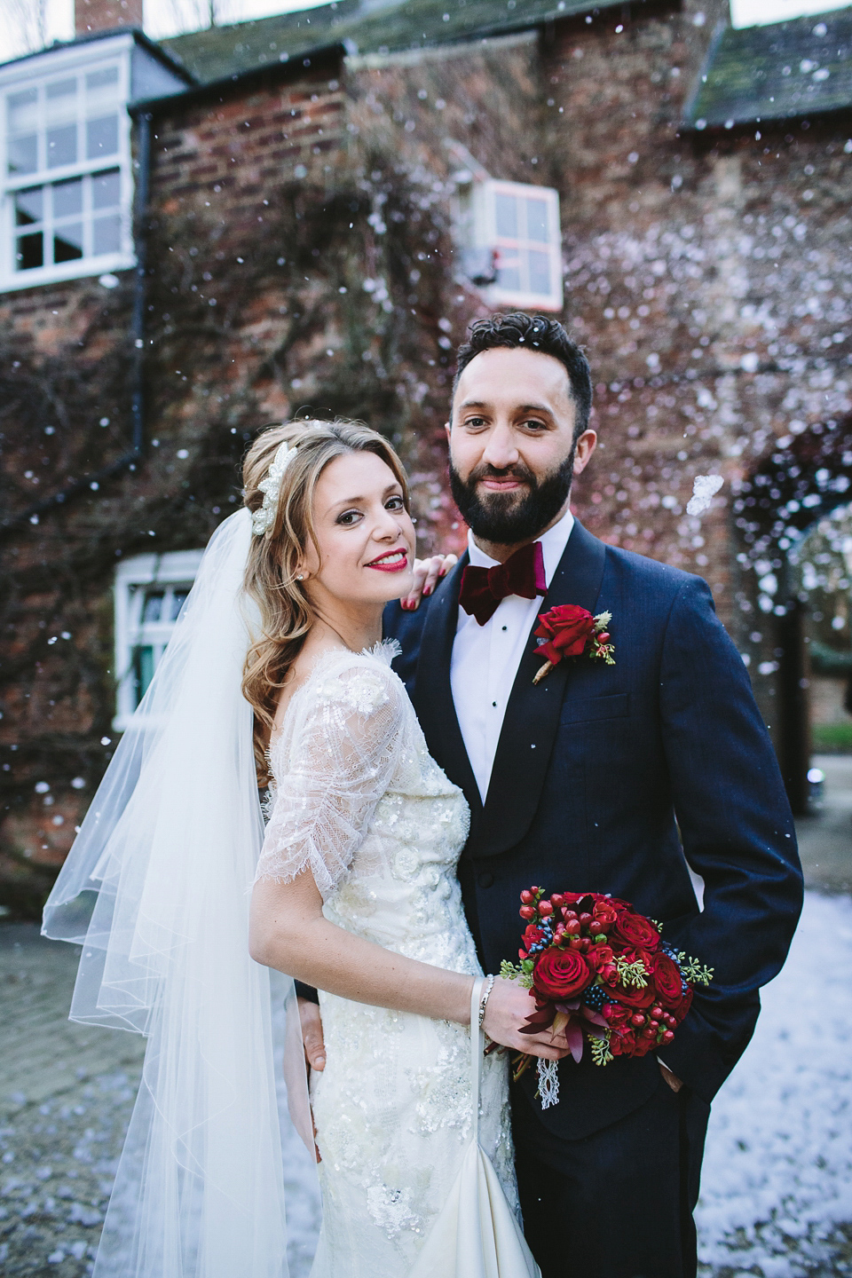 Laura wears 'Mimosa' by Jenny Packham for her winter wedding on the family farm in York. Photography by Kate Gray.