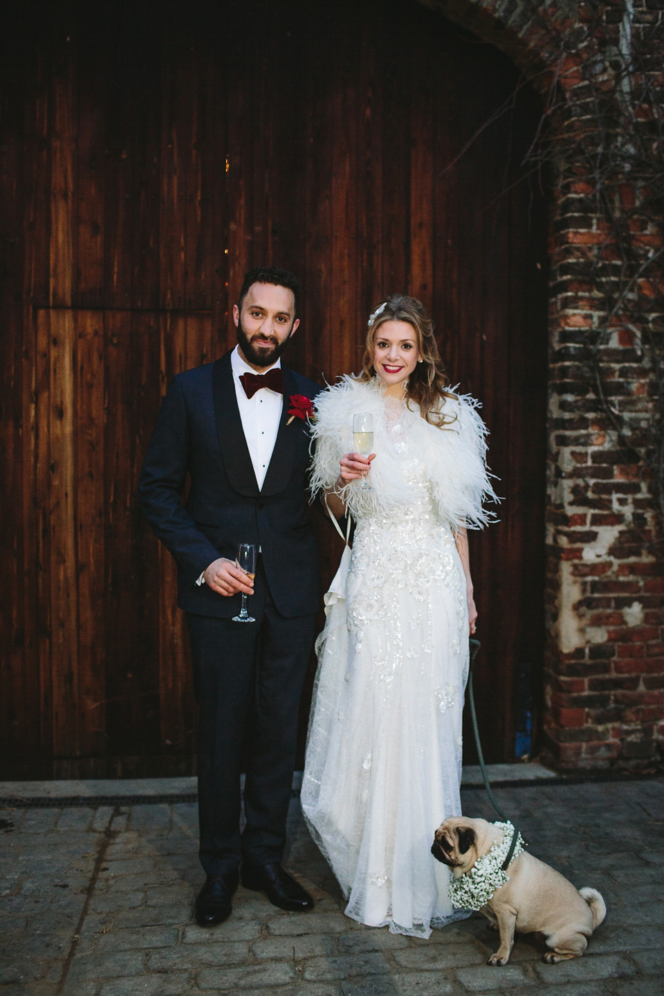 Laura wears 'Mimosa' by Jenny Packham for her winter wedding on the family farm in York. Photography by Kate Gray.