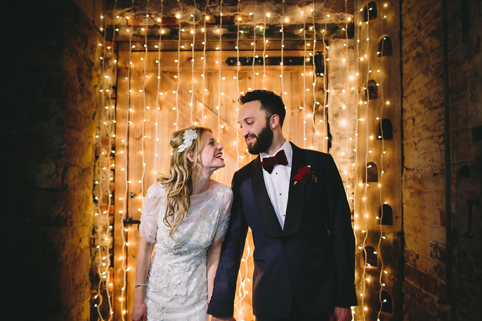 Laura wears 'Mimosa' by Jenny Packham for her winter wedding on the family farm in York. Photography by Kate Gray.