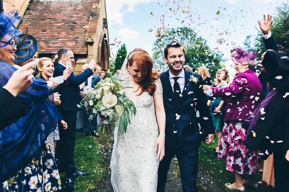 Our Lovettes member Emily wore a glamorous Jenny Packham gown for her elegant, English country wedding at Shustoke Farm Barns. Photography by Mister Phill.