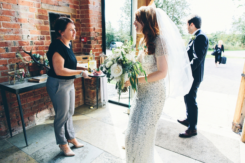 Our Lovettes member Emily wore a glamorous Jenny Packham gown for her elegant, English country wedding at Shustoke Farm Barns. Photography by Mister Phill.