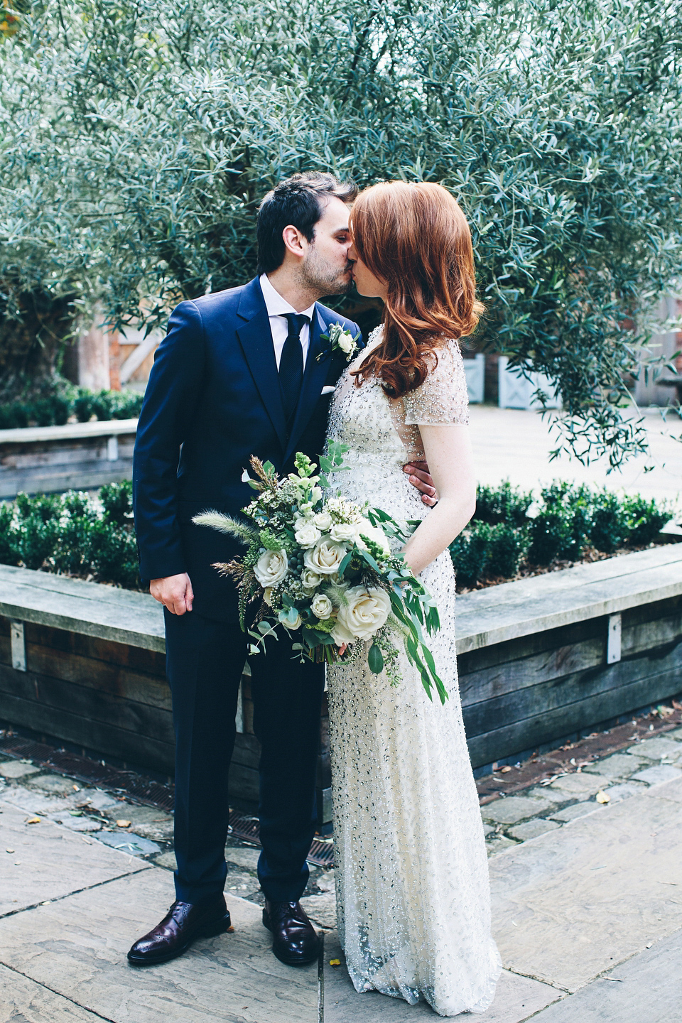 Our Lovettes member Emily wore a glamorous Jenny Packham gown for her elegant, English country wedding at Shustoke Farm Barns. Photography by Mister Phill.