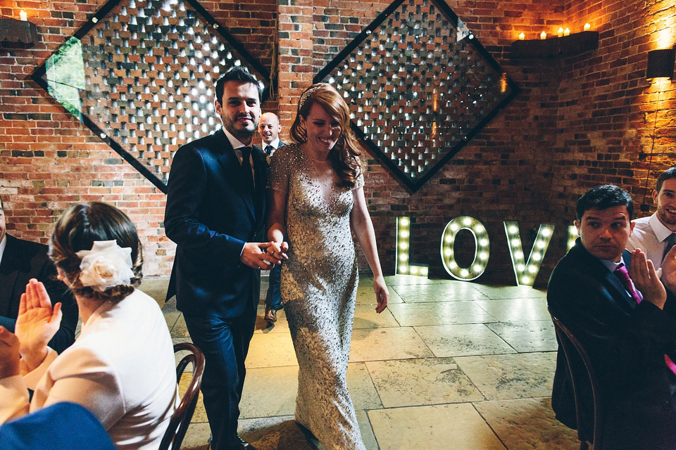 Our Lovettes member Emily wore a glamorous Jenny Packham gown for her elegant, English country wedding at Shustoke Farm Barns. Photography by Mister Phill.