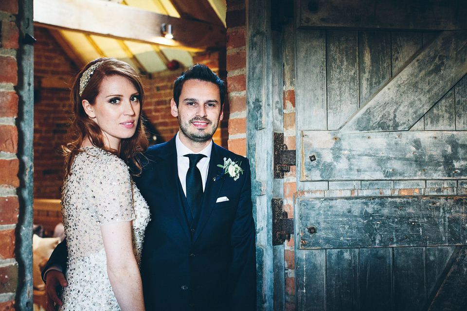 Our Lovettes member Emily wore a glamorous Jenny Packham gown for her elegant, English country wedding at Shustoke Farm Barns. Photography by Mister Phill.