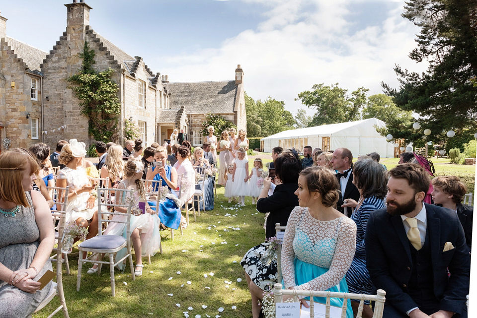 An Essense of Australia dress for a homespun, outdoor, country wedding in pretty pastel shades. Photography by Julie Tinton.