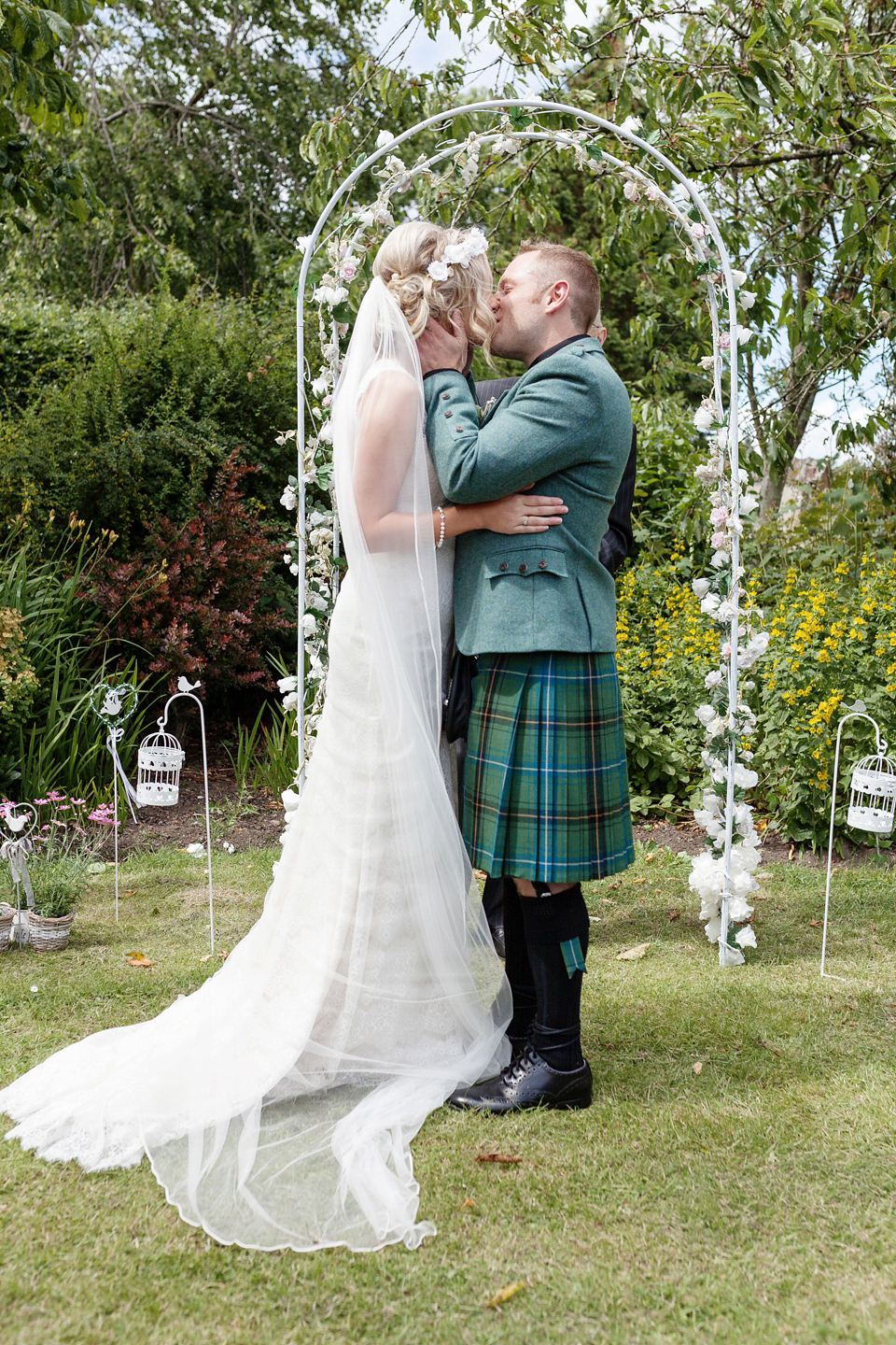 An Essense of Australia dress for a homespun, outdoor, country wedding in pretty pastel shades. Photography by Julie Tinton.