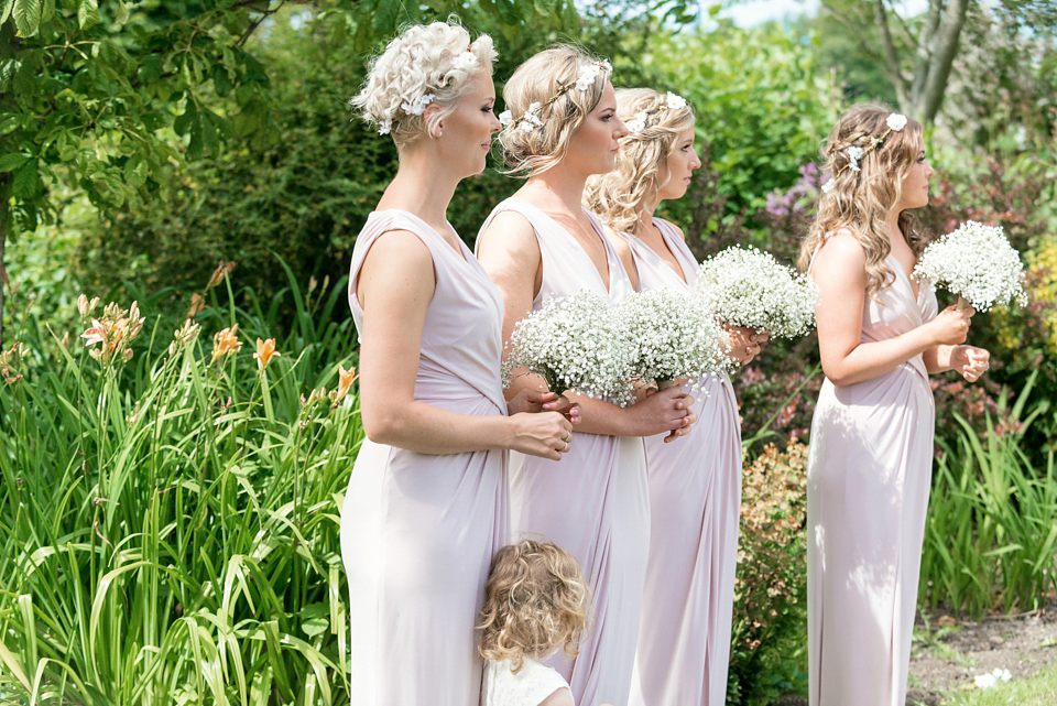 An Essense of Australia dress for a homespun, outdoor, country wedding in pretty pastel shades. Photography by Julie Tinton.