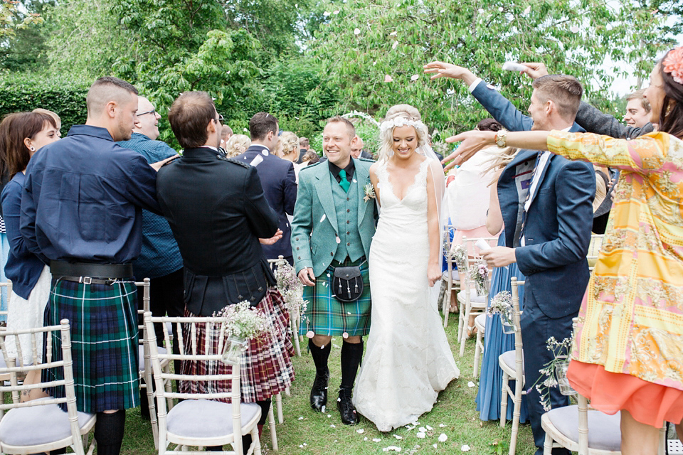 An Essense of Australia dress for a homespun, outdoor, country wedding in pretty pastel shades. Photography by Julie Tinton.