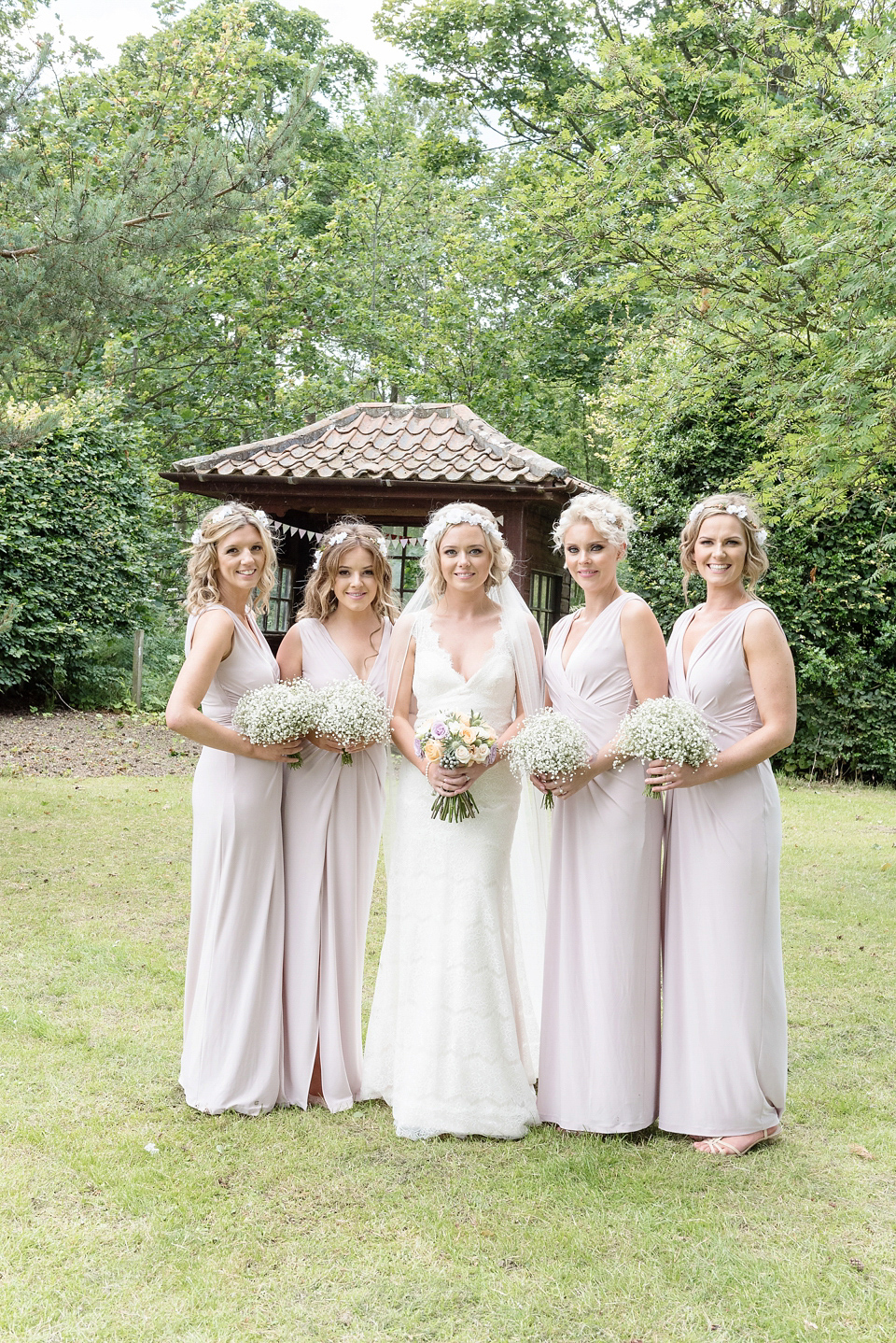 An Essense of Australia dress for a homespun, outdoor, country wedding in pretty pastel shades. Photography by Julie Tinton.