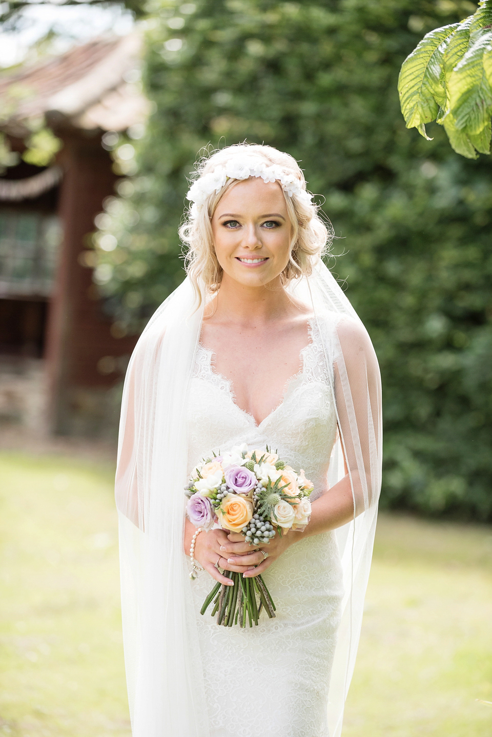 An Essense of Australia dress for a homespun, outdoor, country wedding in pretty pastel shades. Photography by Julie Tinton.