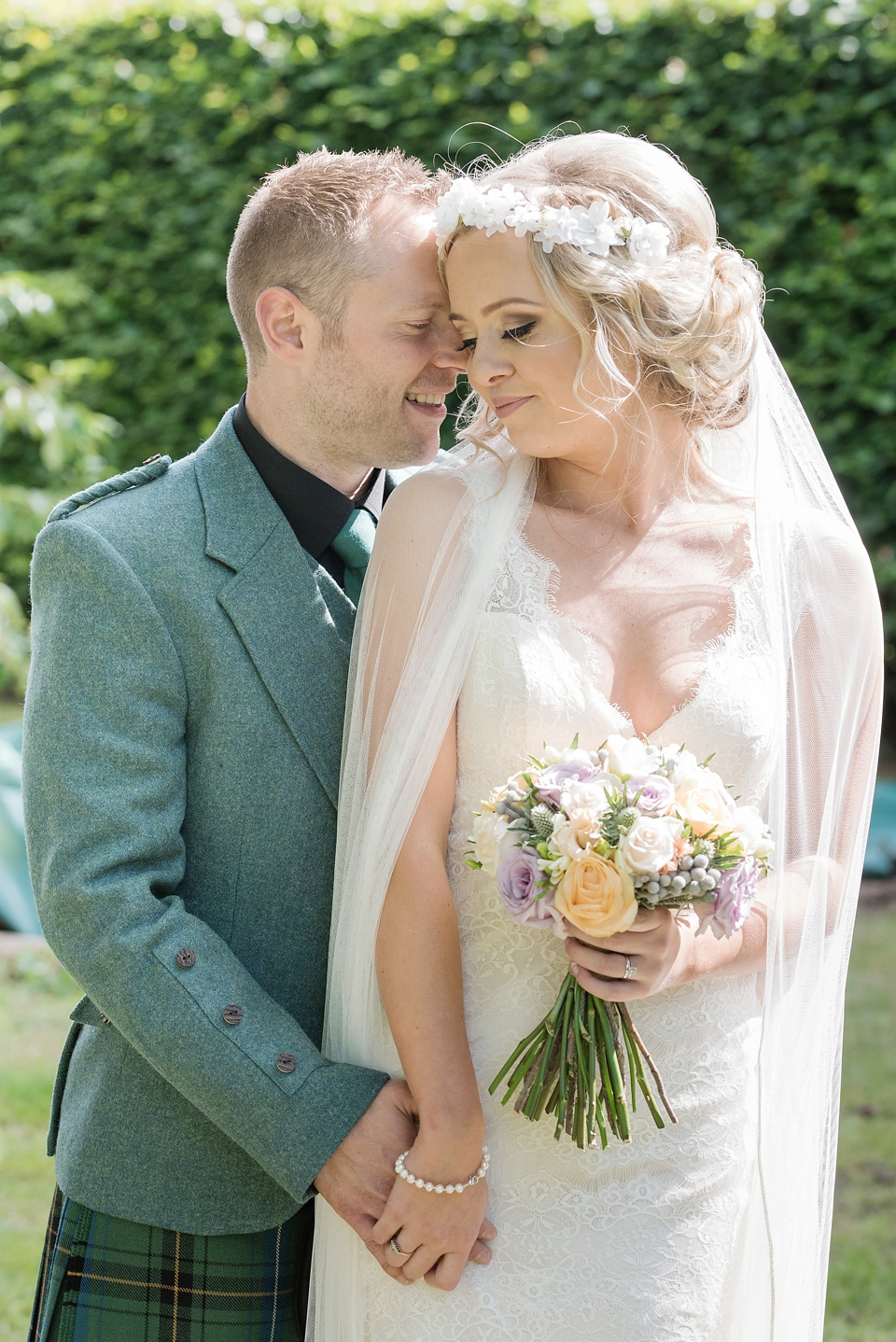 An Essense of Australia dress for a homespun, outdoor, country wedding in pretty pastel shades. Photography by Julie Tinton.