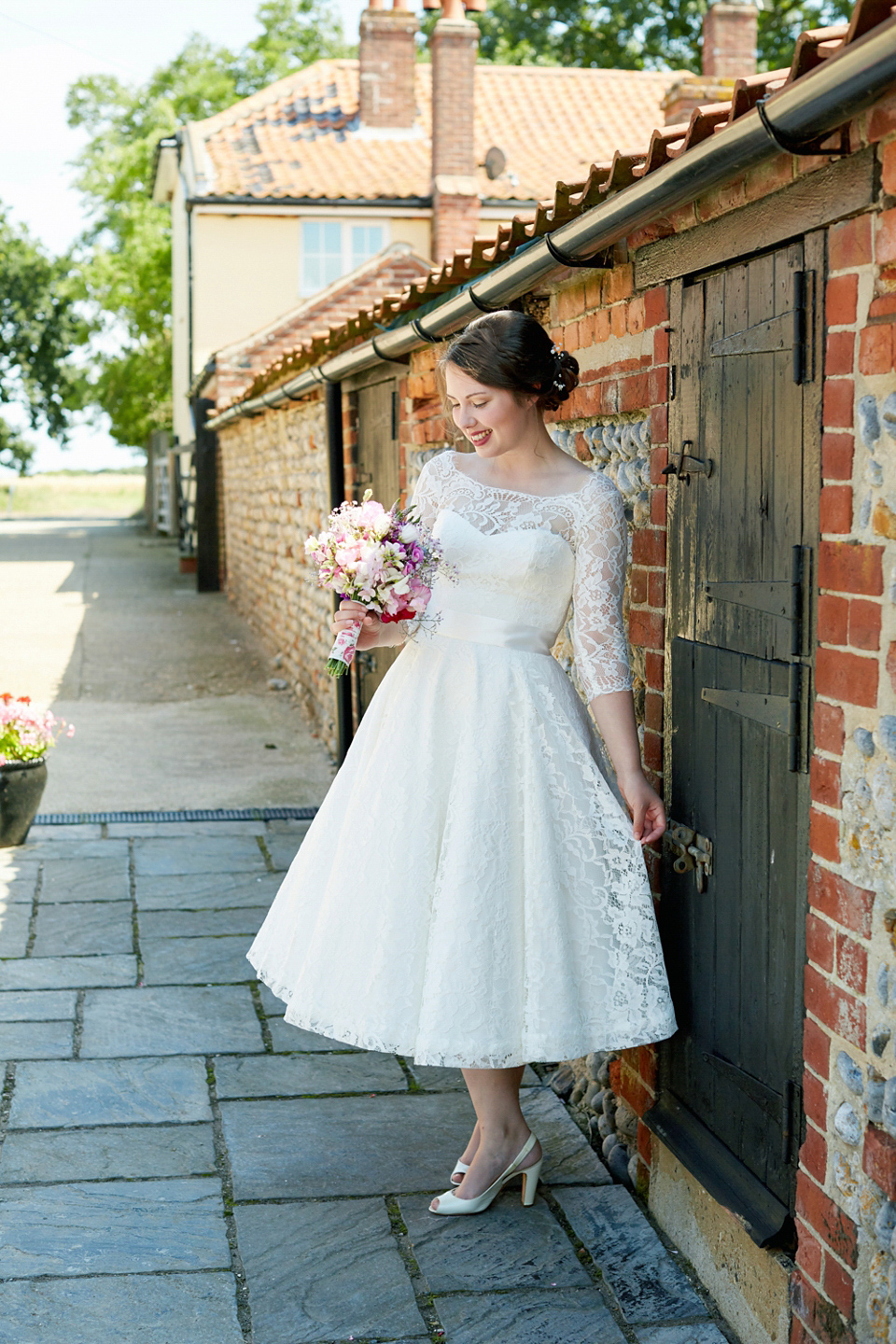 A fabulous 1950's Fur Coat No Knickers dress for a flower-filled Norfolk countryside wedding. Images by Fuller Photography.