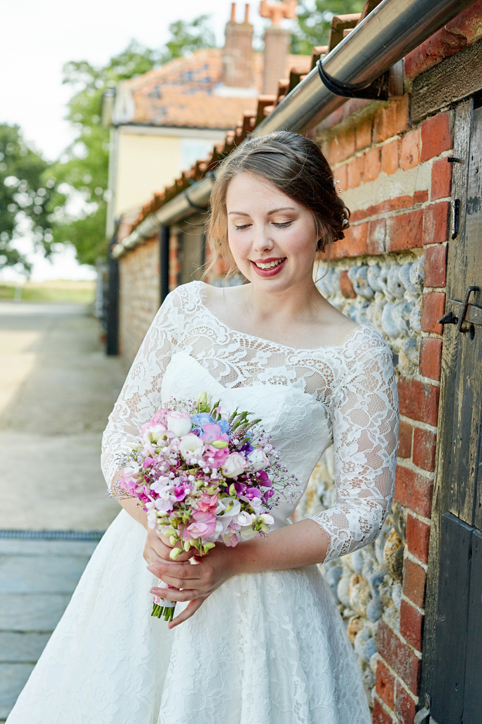 A fabulous 1950's Fur Coat No Knickers dress for a flower-filled Norfolk countryside wedding. Images by Fuller Photography.