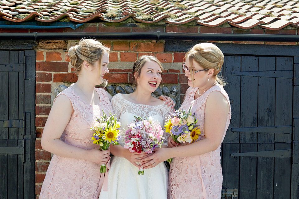 A fabulous 1950's Fur Coat No Knickers dress for a flower-filled Norfolk countryside wedding. Images by Fuller Photography.