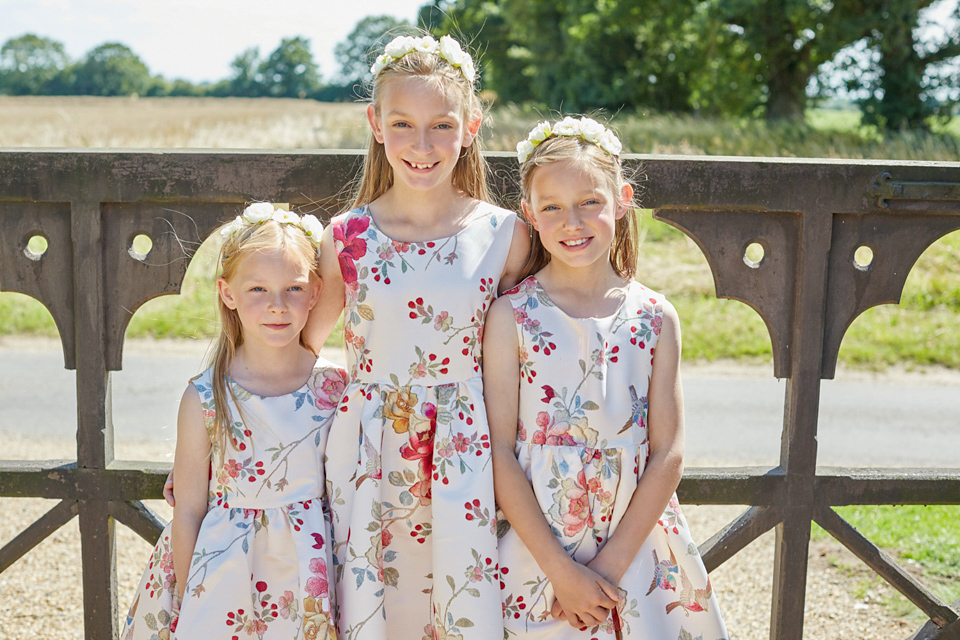 A fabulous 1950's Fur Coat No Knickers dress for a flower-filled Norfolk countryside wedding. Images by Fuller Photography.