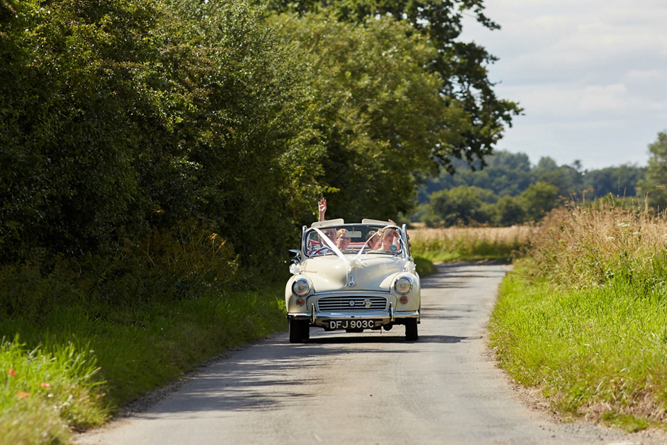 A fabulous 1950's Fur Coat No Knickers dress for a flower-filled Norfolk countryside wedding. Images by Fuller Photography.