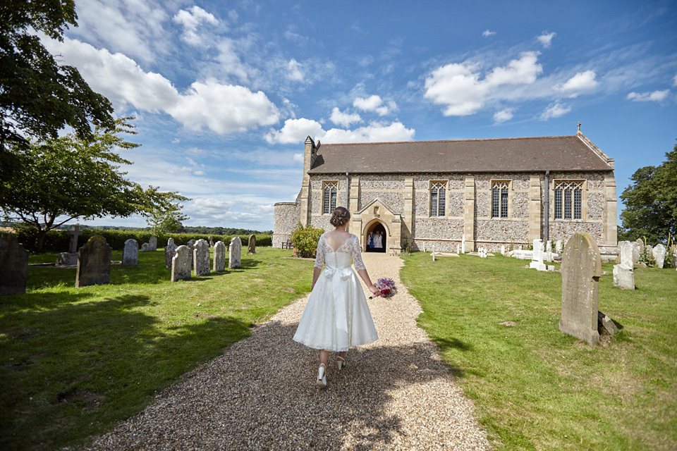 A fabulous 1950's Fur Coat No Knickers dress for a flower-filled Norfolk countryside wedding. Images by Fuller Photography.