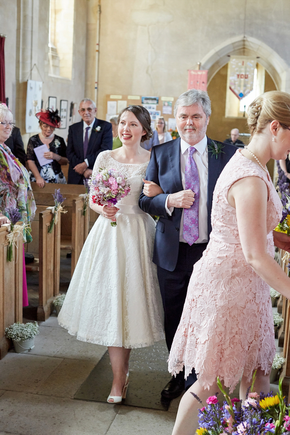 A fabulous 1950's Fur Coat No Knickers dress for a flower-filled Norfolk countryside wedding. Images by Fuller Photography.