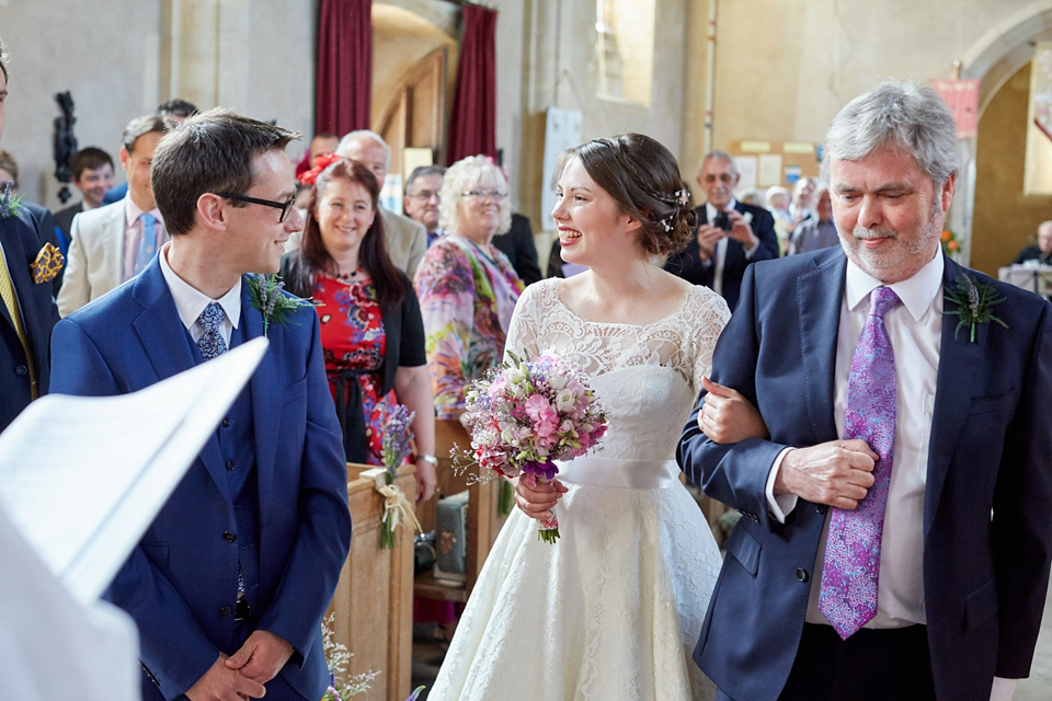 A fabulous 1950's Fur Coat No Knickers dress for a flower-filled Norfolk countryside wedding. Images by Fuller Photography.