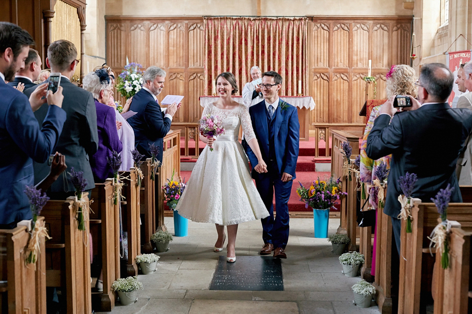 A fabulous 1950's Fur Coat No Knickers dress for a flower-filled Norfolk countryside wedding. Images by Fuller Photography.