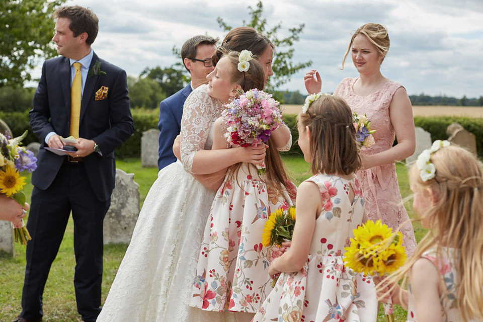 A fabulous 1950's Fur Coat No Knickers dress for a flower-filled Norfolk countryside wedding. Images by Fuller Photography.