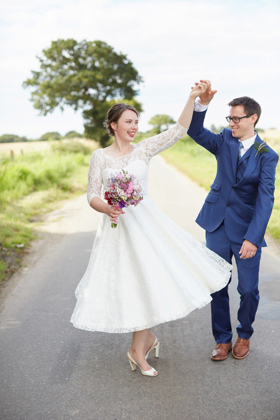 A fabulous 1950's Fur Coat No Knickers dress for a flower-filled Norfolk countryside wedding. Images by Fuller Photography.