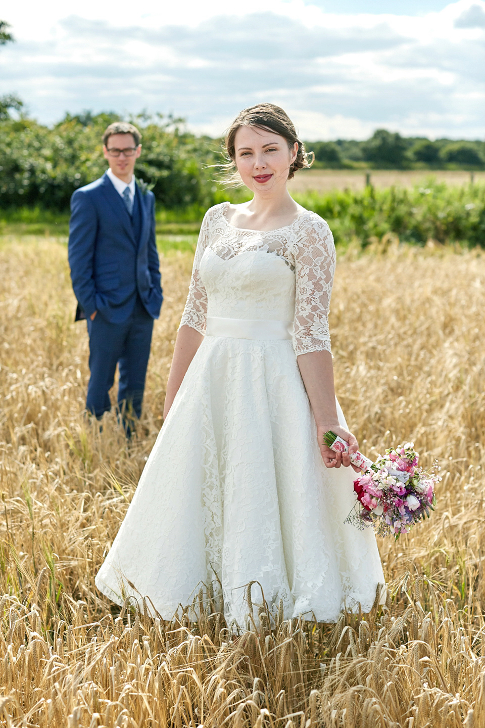 A fabulous 1950's Fur Coat No Knickers dress for a flower-filled Norfolk countryside wedding. Images by Fuller Photography.