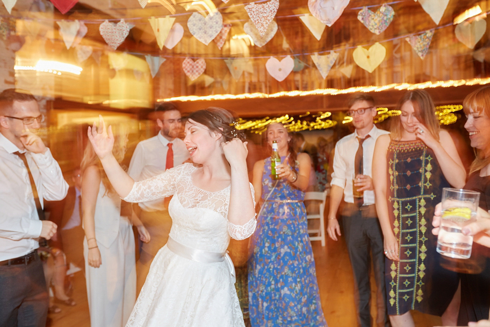 A fabulous 1950's Fur Coat No Knickers dress for a flower-filled Norfolk countryside wedding. Images by Fuller Photography.