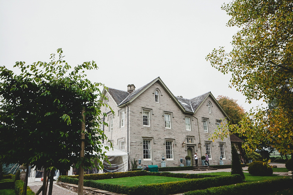 Bride Abby wears a gown by Wilden Bride of London for her Autumn wedding at Lemore Manor in Herefordshire. Photography by Sarah Beth, flowers by Juliet Glaves.