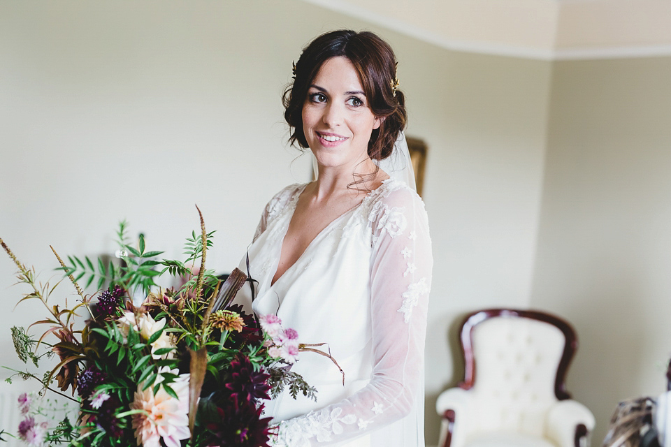 Bride Abby wears a gown by Wilden Bride of London for her Autumn wedding at Lemore Manor in Herefordshire. Photography by Sarah Beth, flowers by Juliet Glaves.