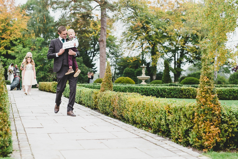 Bride Abby wears a gown by Wilden Bride of London for her Autumn wedding at Lemore Manor in Herefordshire. Photography by Sarah Beth, flowers by Juliet Glaves.