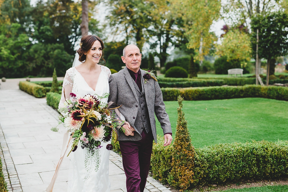 Bride Abby wears a gown by Wilden Bride of London for her Autumn wedding at Lemore Manor in Herefordshire. Photography by Sarah Beth, flowers by Juliet Glaves.