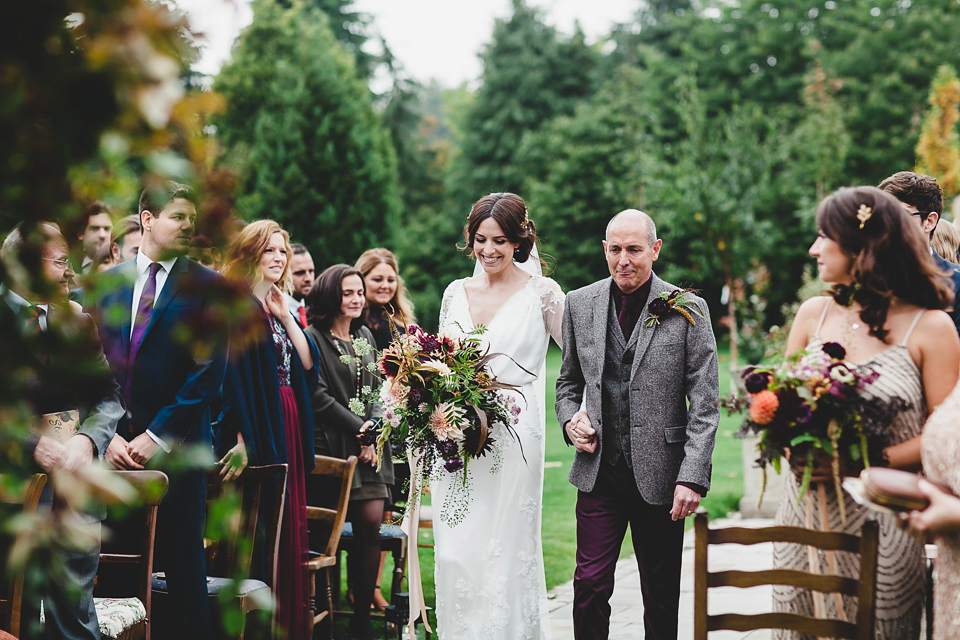 Bride Abby wears a gown by Wilden Bride of London for her Autumn wedding at Lemore Manor in Herefordshire. Photography by Sarah Beth, flowers by Juliet Glaves.