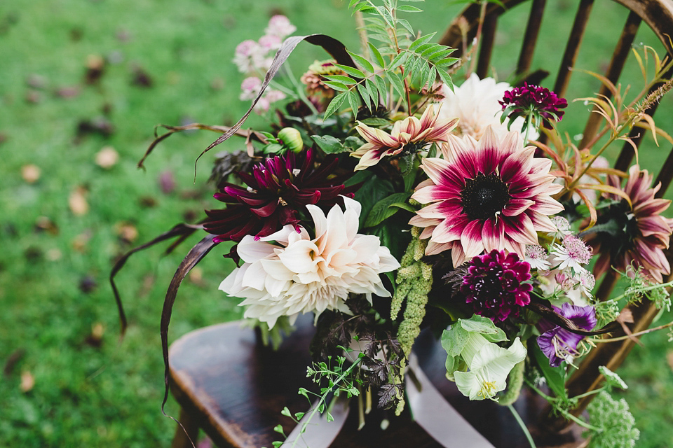 Bride Abby wears a gown by Wilden Bride of London for her Autumn wedding at Lemore Manor in Herefordshire. Photography by Sarah Beth, flowers by Juliet Glaves.