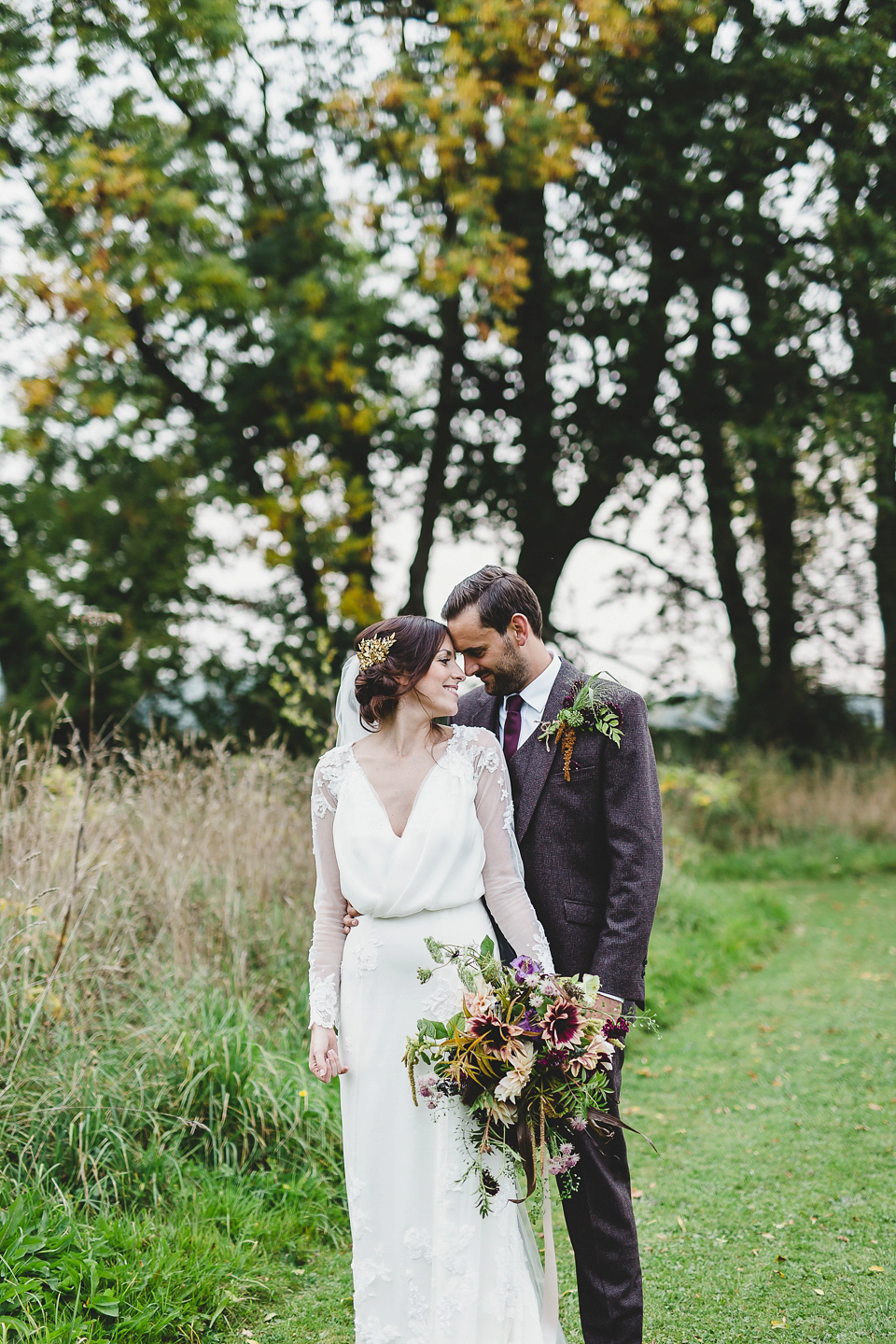 Bride Abby wears a gown by Wilden Bride of London for her Autumn wedding at Lemore Manor in Herefordshire. Photography by Sarah Beth, flowers by Juliet Glaves.