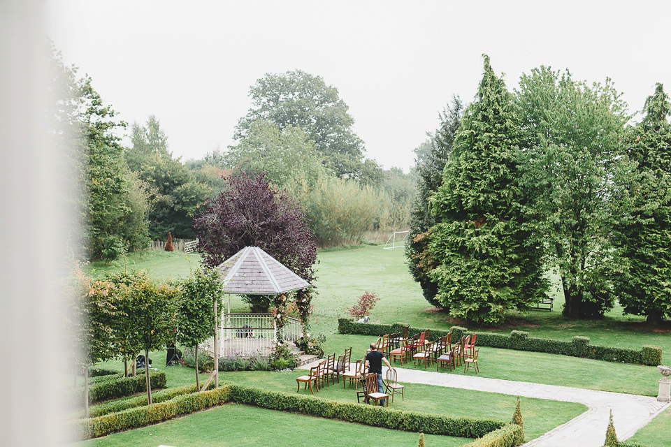 Bride Abby wears a gown by Wilden Bride of London for her Autumn wedding at Lemore Manor in Herefordshire. Photography by Sarah Beth, flowers by Juliet Glaves.