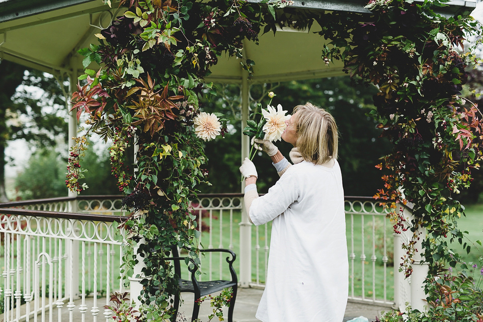 Bride Abby wears a gown by Wilden Bride of London for her Autumn wedding at Lemore Manor in Herefordshire. Photography by Sarah Beth, flowers by Juliet Glaves.