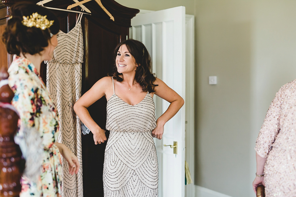 Bride Abby wears a gown by Wilden Bride of London for her Autumn wedding at Lemore Manor in Herefordshire. Photography by Sarah Beth, flowers by Juliet Glaves.