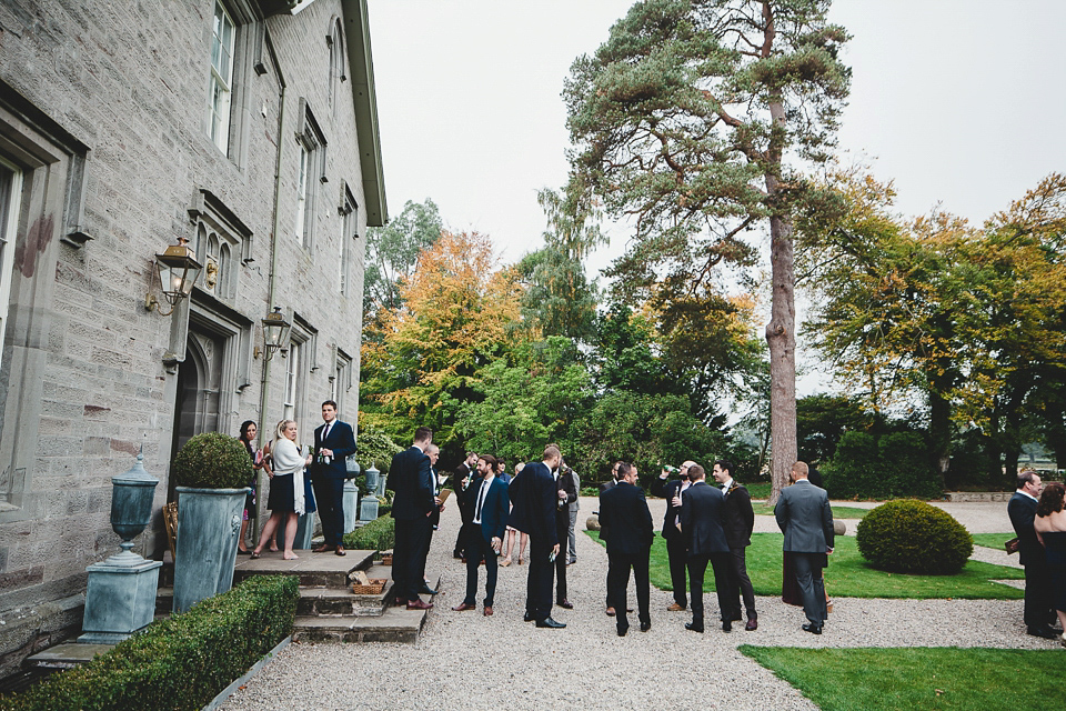 Bride Abby wears a gown by Wilden Bride of London for her Autumn wedding at Lemore Manor in Herefordshire. Photography by Sarah Beth, flowers by Juliet Glaves.