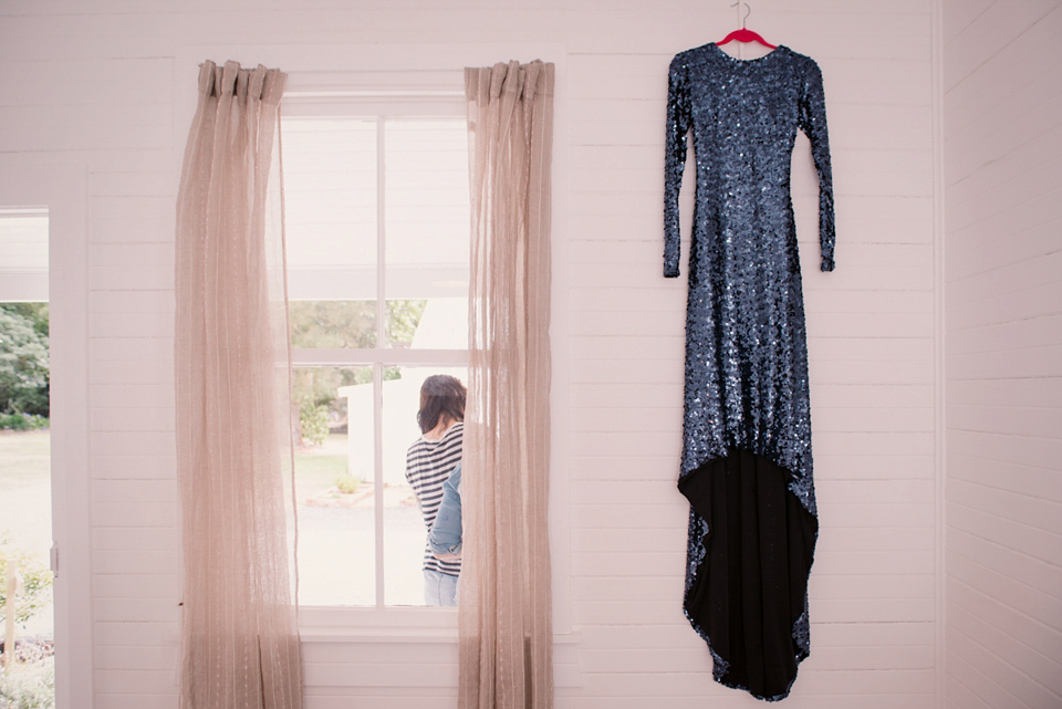 A blue sequin wedding dress for a colourful and flower filled picnic wedding. Photography by Sarah Burton.